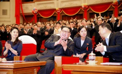 North Korean leader Kim Jong Un and his wife Ri Sol Ju applaud with Song Tao, head of the International Department of Communist Party of China (CPC) Central Committee, in this undated photo released by North Koreas Korean Central News Agency (KCNA) in Pyongyang April 17, 2018 | Reuters