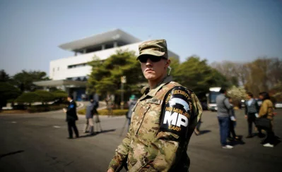 A US army soldier stands guard in front of the Peace House at the truce village of Panmunjom inside the demilitarized zone (DMZ) separating the two Koreas, South Korea, April 18, 2018. Picture taken on April 18, 2018 | Reuters