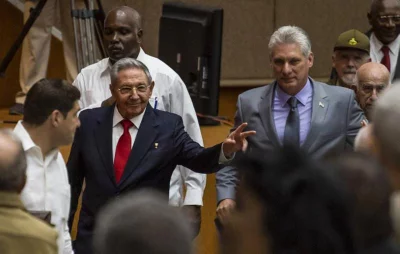 Handout picture released by Cuban official website www.cubadebate.cu showing Cuban President Raul Castro (L) and First Vice-President Miguel Diaz-Canel (C) arriving for a National Assembly session that named the latter as the candidate to succeed Castro as president, in Havana on April 18, 2018 | AFP
