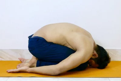 Childs pose - This pose helps to stretch the hips, thighs and lower back while reducing stress and fatigue. nnBegin by sitting on your heels and then slowly fold forward, bringing your chest to your thighs and your forehead to the earth, stay in here for 1-2 minutes, breathing normally.