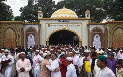 Following the Eid-ul-Fitr prayers, people exiting the Eidgah embrace and greet each other | Rajib Dhar/Dhaka Tribune