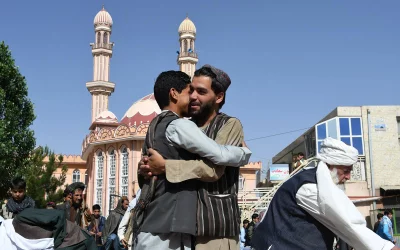 Afghan residents greet each other after al-Fitr prayers marking the end of the holy month of Ramadan, in Ghani on June 15, 2018 AFP