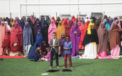 Somali Muslims take part in Eid al-Fitr prayer on June 15, 2018 which marks the end of the holy month of Ramadan at football pitch of the Jamacadaha stadium in Mogadishu, Somalia | AFP