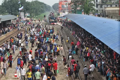 People crowd the platform and the tracks at Dhakas Uttara Airport Railway Station ahead of Eid-ul-Fitr Rajib Dhar