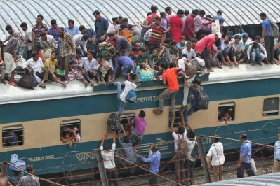 People struggle to get on top of a train ahead of Eid-ul-Fitr at Dhakas Airport Railway Station Rajib Dhar