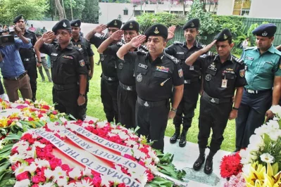 The director general of RAB pays his respects along with his staff | Rajib Dhar/Dhaka Tribune