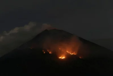 Fire is seen on the slopes of Mount Agung volcano following an eruption as seen from Amed in Karangasem Regency, Bali, Indonesia | Reuters