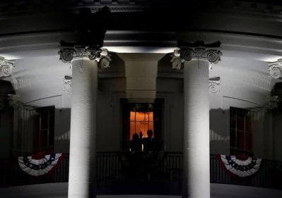 US President Donald Trump and first lady Melania Trump wave from the Truman Balcony during a fireworks display celebrating Independence Day at the White House | Reuters