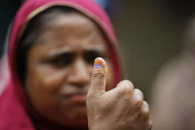A woman holding up her thumb showcasing the indelible ink signifying she has successfully cast her vote in the city corporation polls in Sylhet nMahmud Hossain Opu/Dhaka Tribune
