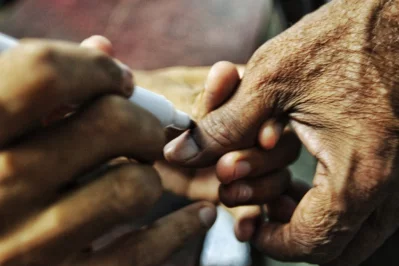 A voter being marked with indelible ink to complete the voting processnRajib Dhar/Dhaka Tribune