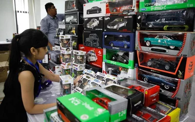 A young visitor interacts with boxed toy cars and action figures at ToyCon 2018 on July 20, 2018 | Mahmud Hossain Opu/Dhaka Tribune