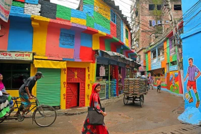 In the old quarters of Dhaka, streets have been painted shades of red and blue, a multi-coloured hue, celebrating the World Cup