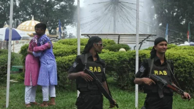 Two young boys embrace and greet each other to celebrate Eid-ul-Azha Rajib Dhar/Dhaka Tribune 