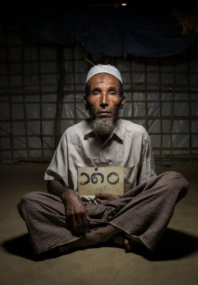 Roshan Ahmed, 65: I am from Maungdaw town. I had a big house on two floors, cattle and land. I left everything there when they [military] were putting fire to villages. I dont know what happened to my animals. I could save a few identity cards with photographs of my family, documents and this number plate of my house. This number plat may come to use some day when we go back.Ahmer Khan/Amnesty International