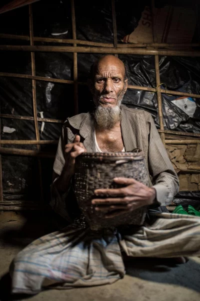 Musa Ali, 70: It took us 21 days to reach Bangladesh. We stayed inside a cave in a forest for many days. I carried this basket because I made it myself when I was in my village Samela. The Myanmar military killed so many people there, burnt down our villages, so we had to run away to save our lives. In this basket, I had some clothes but I couldnt save my identity cards, photos and other documents. I dont know what will happen to us now.Ahmer Khan/Amnesty International