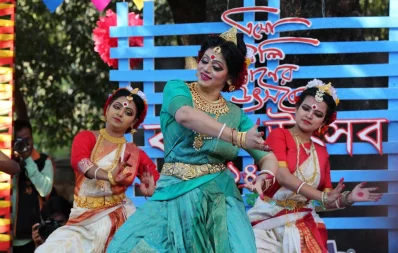 Three performers, in ornate outfits, dance on stage at Pohela Falgun festivities  at Charukola, Dhaka University, on February 13, 2019 | Syed Zakir Hossain