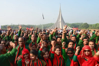 A crowd, wearing coordinated outfits to celebrate the occasion, in front of the National Memorial | Mehedi Hasan/Dhaka Tribune