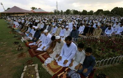 People attend Eid al-Fitr prayers to mark the end of the holy fasting month of Ramadan in Peshawar, Pakistan on June 4, 2019 REUTERS