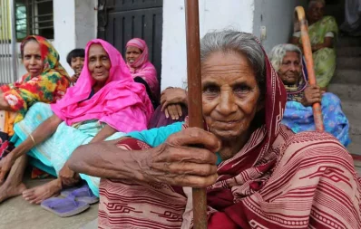 A woman waits to receive her monthlly old age allowance in north Bengal Syed Zakir Hossain/Dhaka Tribune