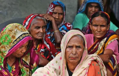 A group of women wait for their turn to receive their monthly allowance Syed Zakir Hossain/Dhaka Tribune