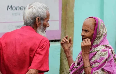 A man and a woman waits outside a bKash shop Syed Zakir Hossain/Dhaka Tribune