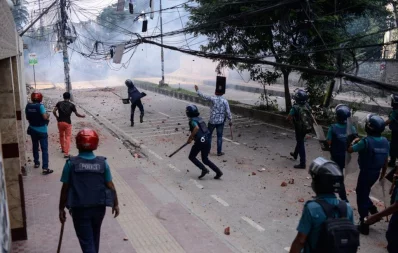 Police officals throwing pieces of bricks and tear gas at the agitated Bihari residents during the clash in Mohammadpur Geneva Camp in Dhaka on Saturday, October 5, 2019 Mahmud Hossain Opu/Dhaka Tribune