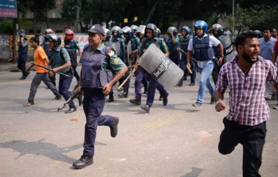 Police officials in persuit of the agitated Bihari residents during the clash at Mohammadpur Geneva Camp in Dhaka on Saturday, October 5, 2019 Mahmud Hossain Opu/ Dhaka Tribune