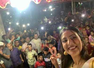 Bidya Sinha Saha Mim distributed clothes in Rajshahiu2019s Bagha region on Mahashtami |nFacebook