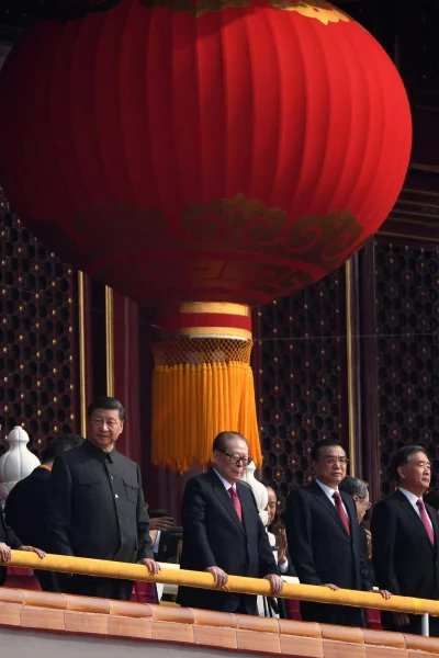 Chinas President Xi Jinping (L) stand with former president Jiang Zemin (C) and Premier Li Keqiang (2nd R) as they watch a military parade in Tiananmen Square in Beijing on October 1, 2019, during celebrations to mark the 70th anniversary of the founding of the Peopleu2019s Republic of China |AFP