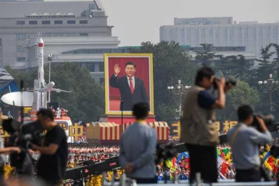 A float with a giant portrait of Chinese President Xi Jinping passes by Tiananmen Square during the National Day parade in Tiananmen Square in Beijing on October 1, 2019, to mark the 70th anniversary of the founding of the Peopleu2019s Republic of China |AFP