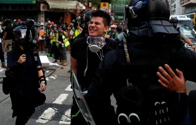 An anti-government demonstrator is detained by police during a protest in Hong Kong, China on October 20, 2019 /Reutersn