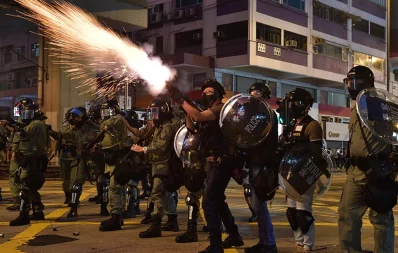 Riot police fire tear gas against protesters during a pro-democracy march in the Kowloon district in Hong Kong on October 20, 2019 /AFP