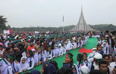 People holding the national flag of Bnagladesh  at National Memorial premises | Rajib Dhar/Dhaka Tribune