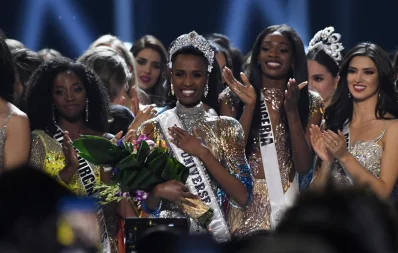 Newly crowned Miss Universe 2019 South Africas Zozibini Tunzi poses on stage with contestants after the 2019 Miss Universe pageant at the Tyler Perry Studios in Atlanta, Georgia on December 8, 2019 AFP