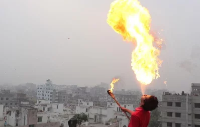 People pull off fire breathing stunts as a part of Shakrain celebrations in old Dhaka on Tuesday, January 14, 2020 Al Nasib Jelanee/Dhaka Tribune