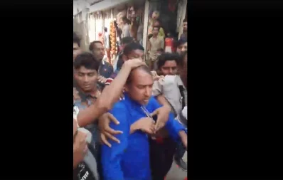 BNP activists protect Tabith Awal from an attack during his campaign on Tuesday, January 21, 2020 | Screenshot taken from Facebook