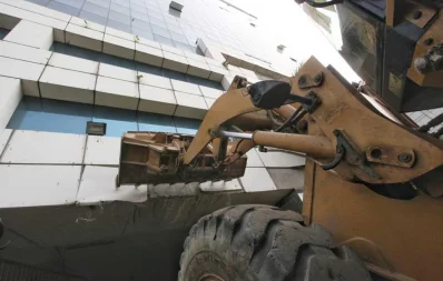 Photo shows a excavator being used in the demolition proces of the BGMEA building in Dhaka on Wednesday, January 22, 2020  Mehedi Hasan/Dhaka Tribune