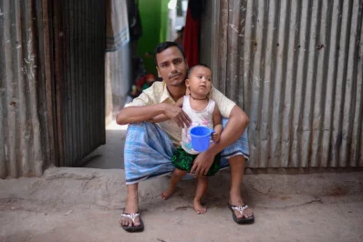 Rafiq, a driver by profession, sits idle in his home in Korail. He has had no work in 25 days since the Coronavirus outbreak | Mahmud Hossain Opu/Dhaka Tribune