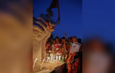 Family members lit candles at the Rana Plaza memorial on an anniversary Syed Zakir Hossain/Dhaka Tribune