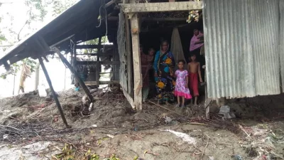 A family takes in the destruction Cyclone Amphan wreaked on their house in Pirojpur on Thursday, May 21, 2020 | Dhaka Tribune
