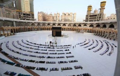 This picture taken early on May 24, 2020 shows worshippers gathering before the Kaaba at the Grand Mosque in Saudi Arabias holy city of Mecca to attend the prayers of Eid al-Fitr, the Muslim holiday which starts at the conclusion of the holy fasting month of Ramadan. AFP