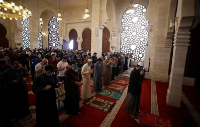 Palestinians perform Eid al-Fitr prayers marking the end of the holy fasting month of Ramadan, amid concerns about the spread of the coronavirus disease (COVID-19), in a mosque in the northern Gaza Strip May 24, 2020 Reuters