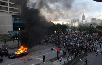 A cop car burns during a protest against the death in Minneapolis police custody of African-American man George Floyd, in Atlanta, Georgia, US May 29, 2020nReuters