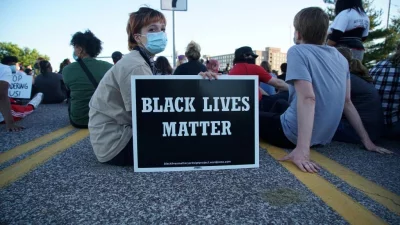 Woman holds a Black Lives Matter sign during a protest against the death in Minneapolis police custody of African-American man George Floyd, in St Louis, Missouri, US May 29, 2020nReuters