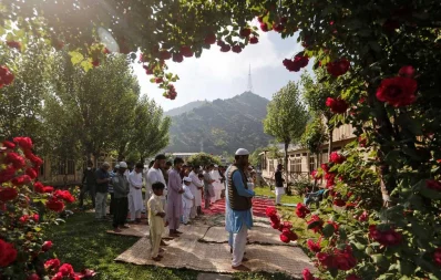 Kashmiri Muslims pray in the garden of a house while celebrating Eid al-Fitr, the Muslim festival marking the end of the holy fasting month of Ramadan, amid the spread of the coronavirus disease (COVID-19) outbreak in Kashmir May 24, 2020 Reuters