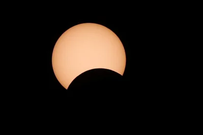 A photo shows a partial solar eclipse observed in Amman, Jordan June 21, 2020Reuters