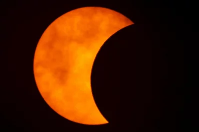 A photo shows a partial solar eclipse observed in Bangkok, Thailand, June 21, 2020 Reuters