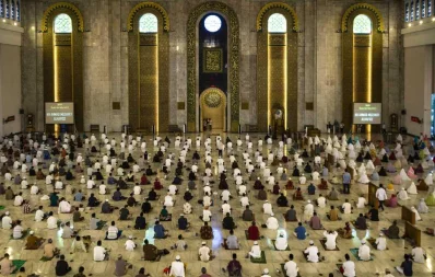 Muslims attend Eid-ul-Azha prayers with social distancing as a preventive measure against the coronavirus at a mosque in Surabaya in East Java on July 31, 2020 AFPnn