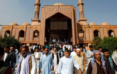 Afghan men leave a mosque after prayers during the Muslim festival of Eid-ul-Azha, amid the spread of the coronavirus, in Kabul, Afghanistan on July 31, 2020 Reuters