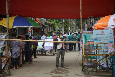 A person uses a megaphone in front of a barricade in Wari on Monday, July 7, 2020 | Mehedi Hasan/Dhaka Tribune